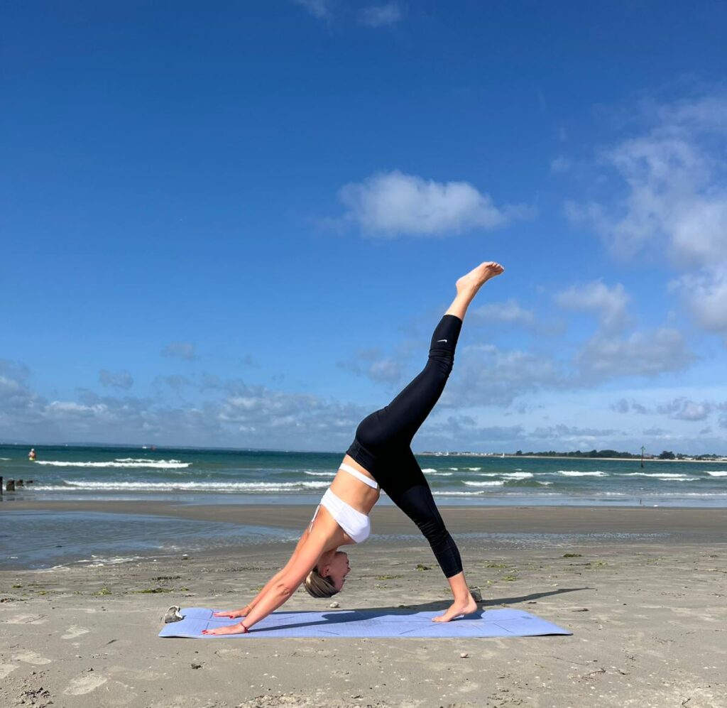 Gentle Hatha Yoga London session with UlaTrains, students in seated pose focusing on breath
