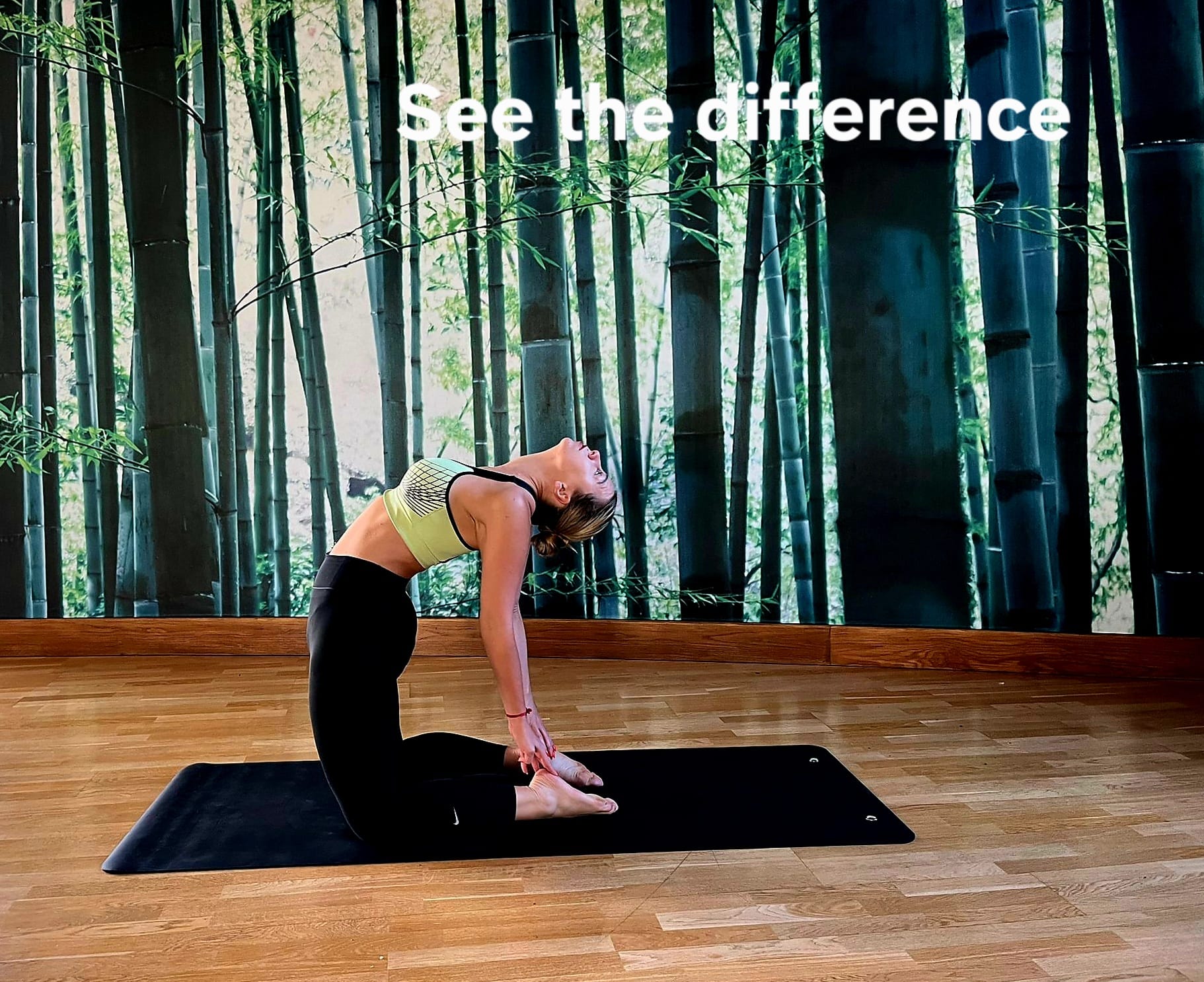 Corporate Yoga London session led by UlaTrains, group in standing forward fold